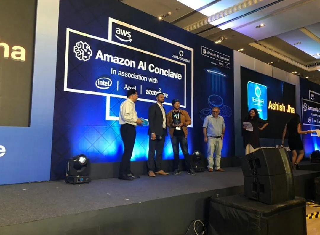 Ashish receiving his Alexa community award on stage at the Amazon AI Conclave.