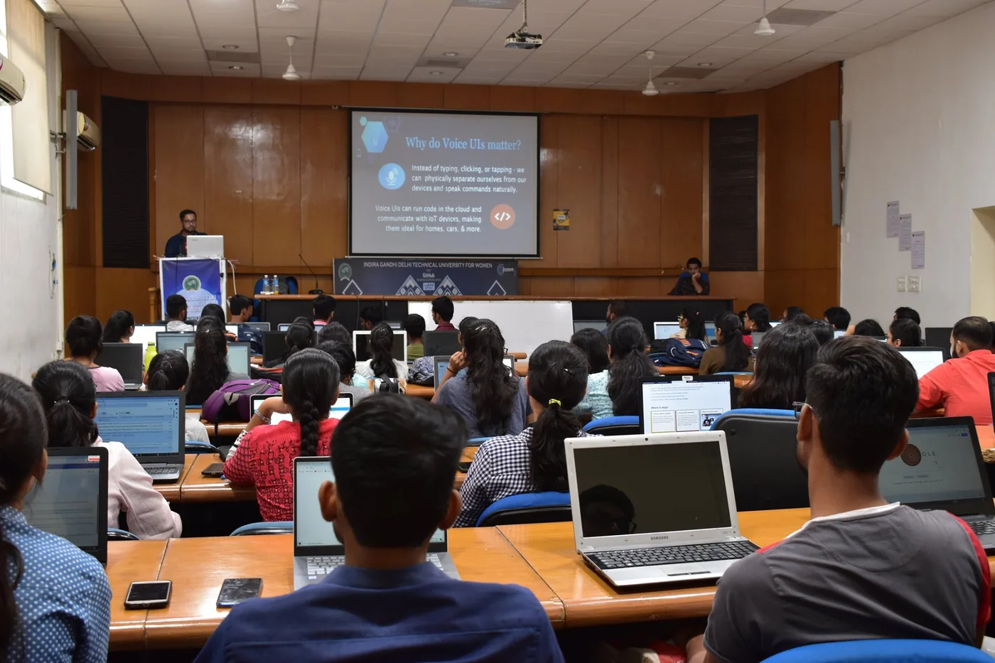A voice-development workshop at IGDTUW, with participants working on laptops.