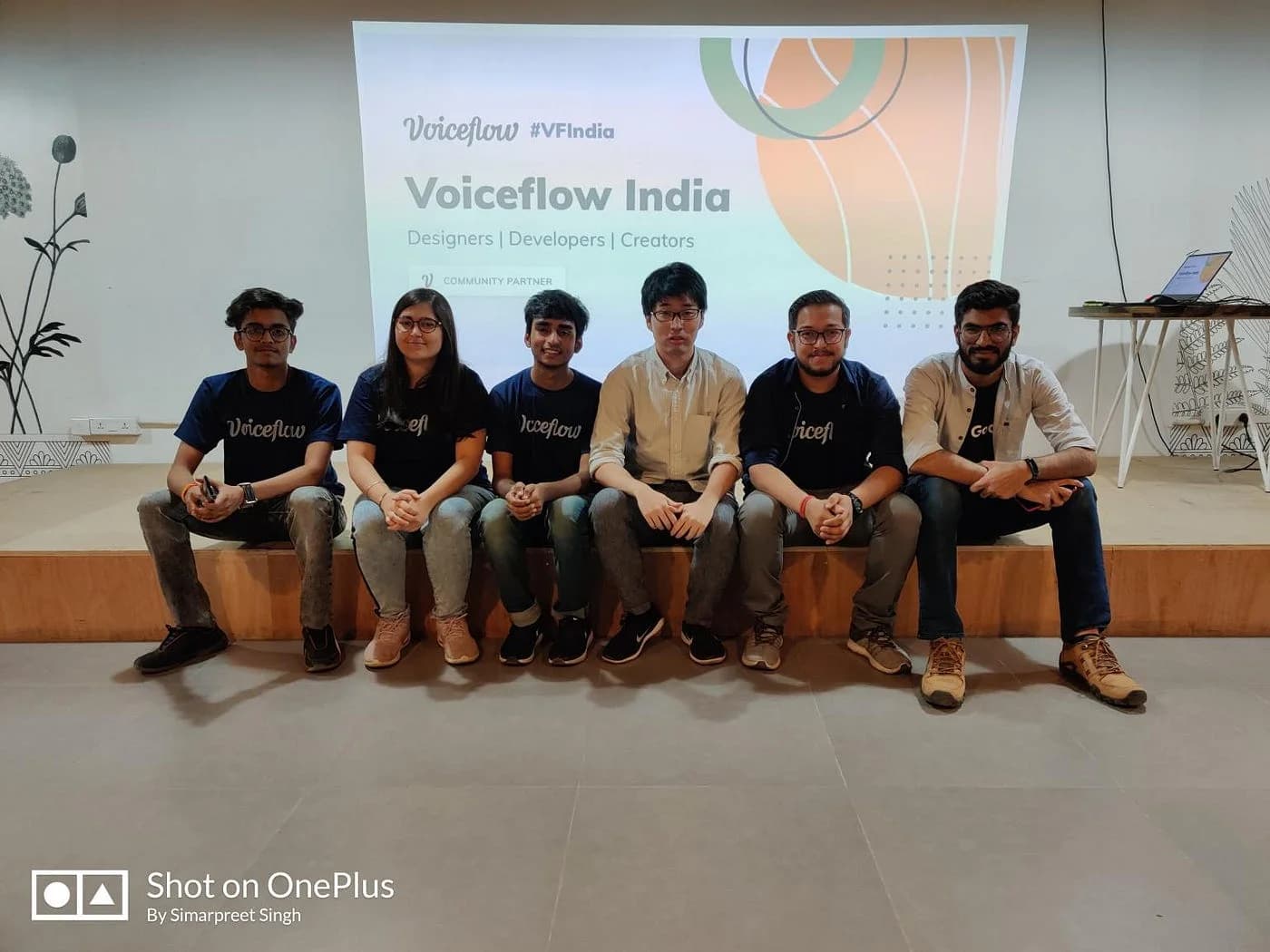 Six people seated on a small stage at the first Voiceflow India meetup.